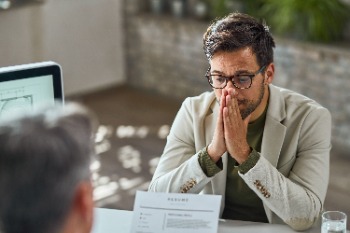 A man looking worried during a job interview