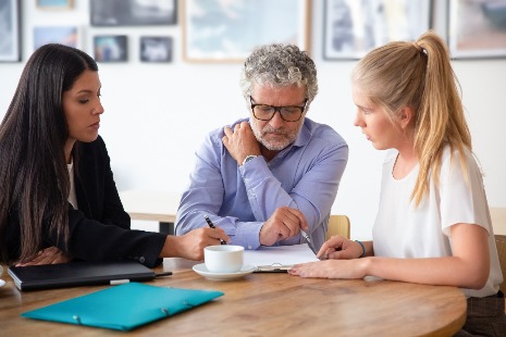 Insurance professional sat with clients